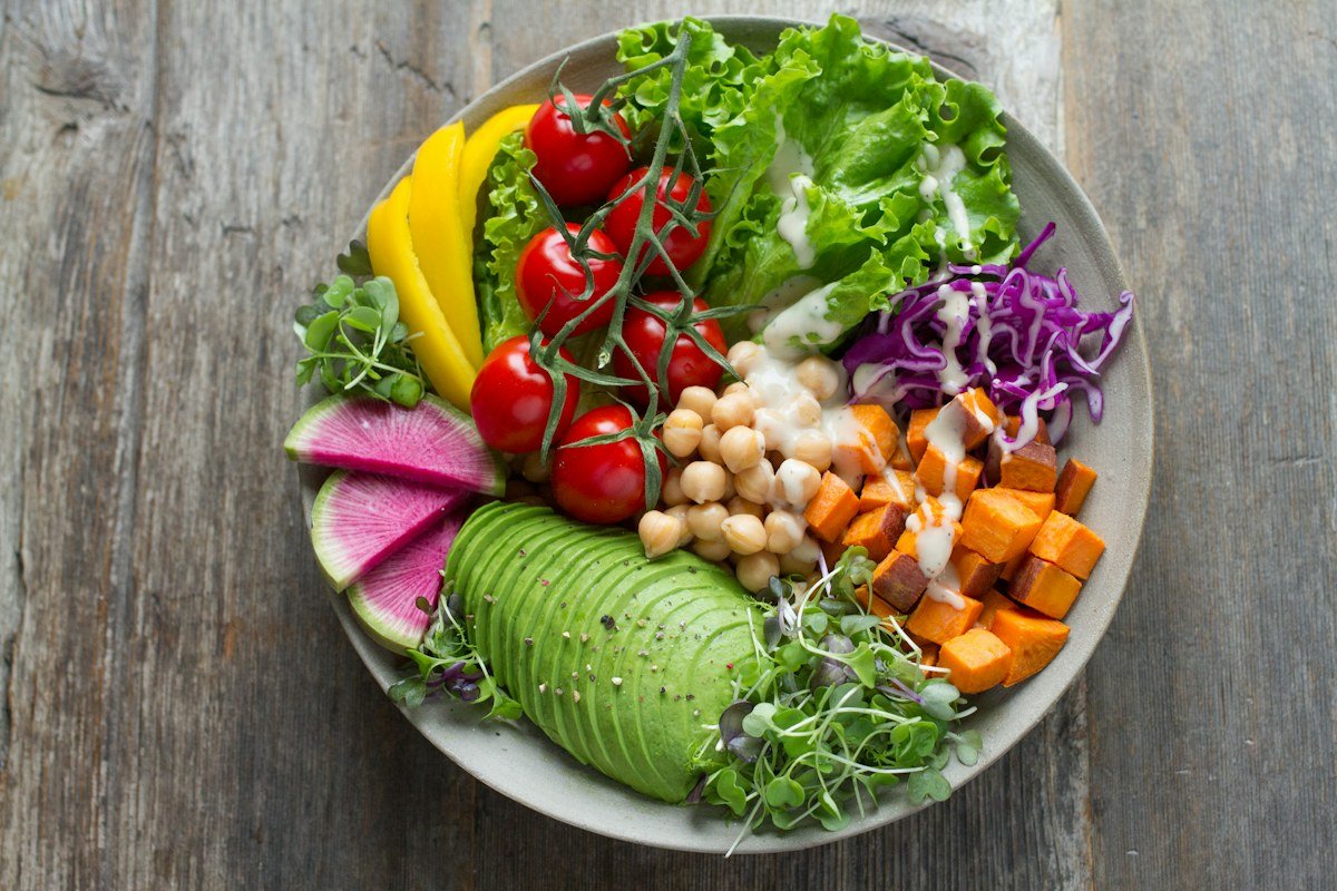 A colourful bowl of vegetables, chickpeas and avocado